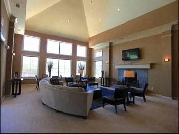 Clubhouse with fireplace and meeting areas